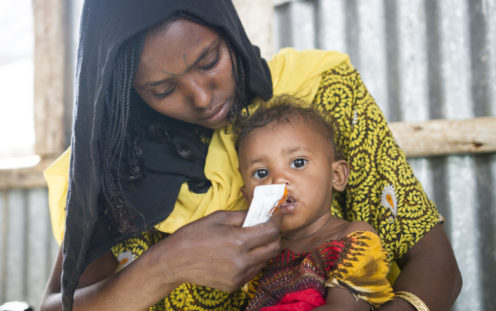 GOAL – Ethiopia – 2018: 23 year-old mum, Merema Ali, with her one year-old baby boy at Berhale refugee camp, in Ethiopia’s Afar region, where GOAL provide nutritional and other supports. Photo: Anteneh Tadele