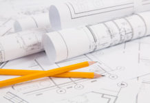 Pencils and paper ?Engineering house drawings and blueprints.