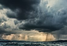 Heavy rain over stormy ocean