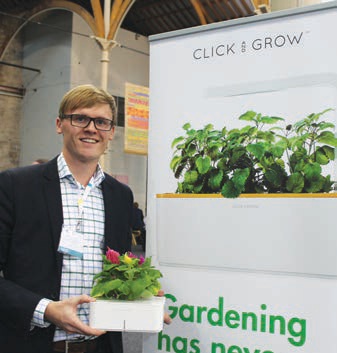 We recently had the pleasure of covering this event at the RDS in Dublin, and were delighted to discover ‘Click & Grow’ who were promoting their ‘Smart Pot’ and ‘Herb Garden’. A person pictured in front of Click and grow banner with a pot with a plant in his hands.
